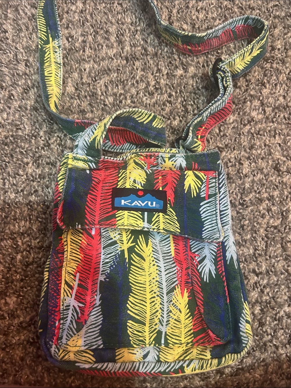 Kavu Crossbody Bag in Red, Yellow, Blue & Gray Feather Print